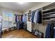 Well-organized walk-in closet with ample shelving and hanging space at 2290 Loring Oak Nw Pl, Marietta, GA 30064