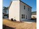 Side exterior of a two-story house with a small backyard at 338 Forkview Dr, Lawrenceville, GA 30044