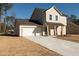 Front exterior view of a two-story home with attached garage and driveway at 338 Forkview Dr, Lawrenceville, GA 30044