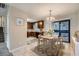 Dining area adjacent to the kitchen with sliding door access to the backyard at 11111 Shannon Cir, Hampton, GA 30228