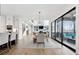 Dining room with a modern light fixture, hardwood floors, and sliding glass doors at 13385 Bishops Ct, Roswell, GA 30075