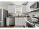 Bright, updated kitchen with white cabinets, stainless steel appliances, and granite countertops at 944 Liberty Hill Ne Rd, Marietta, GA 30066