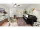 Inviting living area with leather couch, stylish rug, and ample natural light at 944 Liberty Hill Ne Rd, Marietta, GA 30066