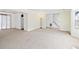 Open living room with neutral carpet and access to the stairs at 3376 Timbercreek Dr, Lawrenceville, GA 30044