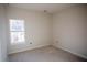 Unfurnished bedroom with neutral walls, white trim, and window at 101 Azalea Dr, Villa Rica, GA 30180