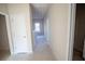 Hallway with doors leading to various rooms and natural light at 101 Azalea Dr, Villa Rica, GA 30180