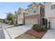 Street view of townhomes with landscaping and attached garages at 162 Alday Ln, Marietta, GA 30060