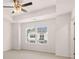 Bright bedroom with carpeted floor, ceiling fan, and window at 989 Cades Walk # 144, Lawrenceville, GA 30045