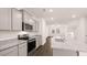 Modern kitchen with gray cabinets and granite countertops at 989 Cades Walk, Lawrenceville, GA 30045