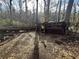 Backyard with fallen tree and wooded area at 202 Hayes St, Villa Rica, GA 30180