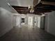Living room with tile flooring, ceiling fan, and columns at 202 Hayes St, Villa Rica, GA 30180