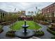 Serene green space with a central fountain, brick walkways, and benches at 531 S Main St # 210, Alpharetta, GA 30009