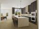 Modern kitchen with dark cabinets, large island, and stainless steel appliances at 531 S Main St # 210, Alpharetta, GA 30009