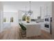 Bright kitchen with white cabinets, waterfall island, and stainless steel appliances at 531 S Main St # 210, Alpharetta, GA 30009