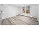 Well-lit bedroom featuring light walls and wood-look vinyl flooring at 1007 Fairway Seven, Villa Rica, GA 30180