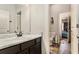 Bathroom with vanity and toilet; view of bedroom at 120 Emerson Trl, Covington, GA 30016