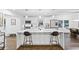 Modern kitchen with white cabinets, quartz countertops, and island at 1819 Pennington Se Pl, Atlanta, GA 30316