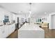 Modern kitchen boasts white cabinets and a large island at 1819 Pennington Se Pl, Atlanta, GA 30316