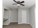 Bedroom with ceiling fan, carpeted floors, and built-in counter at 2579 Sweetridge Ct, Lithia Springs, GA 30122