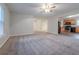 Living room with neutral walls, carpeting, ceiling fan, and open layout at 5901 Bluegrass Vw, Fairburn, GA 30213