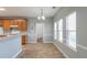 Breakfast nook with tile floor, three windows, and access to the kitchen and laundry room at 141 Vinings Dr, Mcdonough, GA 30253