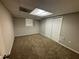 Finished basement room with neutral walls, carpeting, a window, and closet doors at 6968 Sandtown Ln, Stone Mountain, GA 30087