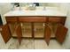 Bathroom vanity with open cabinets showing plumbing and storage space at 1983 Burns View Ln, Lawrenceville, GA 30044