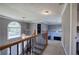 Hallway with wooden railing, carpet, and large window at 3634 Autumn Ridge Pkwy, Marietta, GA 30066