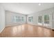 Bright sunroom with tile flooring and French doors leading to the backyard at 305 Haley Cir, Atlanta, GA 30349