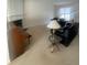 Living room with carpeted floors, a fireplace, and two black leather couches at 3908 Howell Park Rd, Duluth, GA 30096