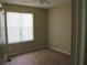 Bedroom with carpeted flooring, ceiling fan, and large window at 959 Romer Pl, Stone Mountain, GA 30083