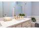 Close-up of the modern double vanity with quartz countertop and gold fixtures in the bathroom at 1061 Shasta Ct, Jonesboro, GA 30238