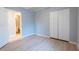 Bedroom with closet and light wood-look flooring at 1061 Shasta Ct, Jonesboro, GA 30238