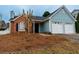 Charming blue and brick home with two-car garage and landscaped yard at 1061 Shasta Ct, Jonesboro, GA 30238