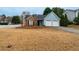 Quaint home with a two-car garage and fenced front yard at 1061 Shasta Ct, Jonesboro, GA 30238