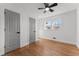 Bright bedroom with gray doors, hardwood floors, and ceiling fan at 1986 Twin Falls Rd, Decatur, GA 30032