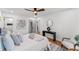 Main bedroom featuring hardwood floors, ceiling fan, and ensuite bathroom access at 1986 Twin Falls Rd, Decatur, GA 30032