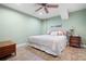 Basement bedroom with king-size bed, nightstand, and ceiling fan at 201 Rippling Nw Dr, Marietta, GA 30064