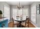 Cozy breakfast nook with a round table and chairs, surrounded by windows at 201 Rippling Nw Dr, Marietta, GA 30064