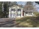 House exterior featuring a two-car garage and basketball goal at 3337 Oak Dr, Snellville, GA 30078