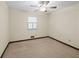 Bright bedroom with ceiling fan and carpet flooring at 5509 Rodney Ln, Stone Mountain, GA 30087