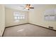 Bright bedroom with ceiling fan, window shutters, and carpet flooring at 5509 Rodney Ln, Stone Mountain, GA 30087