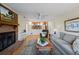 Living room with fireplace, comfortable seating, and hardwood floors at 5509 Rodney Ln, Stone Mountain, GA 30087