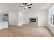 Living room featuring a fireplace, wood-look flooring, and a ceiling fan at 2219 Nena Way # 22, Tucker, GA 30084