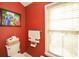 Small bathroom with toilet and red walls at 4754 Ivy Ridge Se Dr # 1, Atlanta, GA 30339