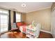 Bright bedroom with hardwood floors, large windows, and plenty of closet space at 4754 Ivy Ridge Se Dr # 1, Atlanta, GA 30339