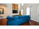 Open living room featuring hardwood floors and a blue sectional sofa at 4754 Ivy Ridge Se Dr # 1, Atlanta, GA 30339