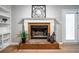 Close-up of the brick fireplace with white mantel and built-in shelves at 134 Springstead Sw Ct, Marietta, GA 30060