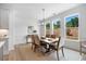 Dining area with large windows providing ample natural light and scenic views at 302 Bunker Hill Ct, Acworth, GA 30102