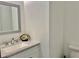 Bathroom with a vanity, a toilet and a framed mirror at 3053 Herscu Way, Stonecrest, GA 30038